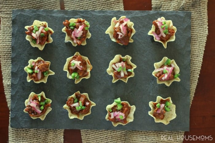 Spicy BBQ Bites. Chips filled with ground beef, bbq sauce, red onion, and jalapenos