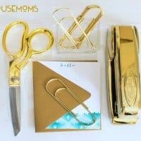creating an inspirational workspace. All gold Office supplies Scissors, paper clis, Stapler, hello note with gold envalope