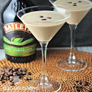 Bailey's Flat White Martini. Cocktail is served in two Martini glasses garnished with three coffee beans