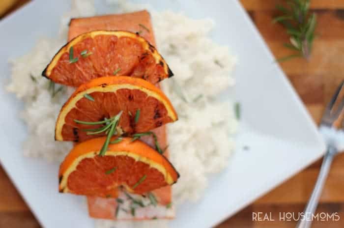 Grilled Orange-Rosemary Salmon, on a bed of white rice topped with orange slices
