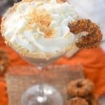 Samoa latte Martini. Topped with whip cream garnished with samoa girl scout cookies. Served in a martini glass