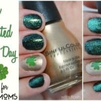 st patricks day mani pictorial. Nails are green, gold and black with a little green shamrock on index finger. Hand is holding gold nail polish