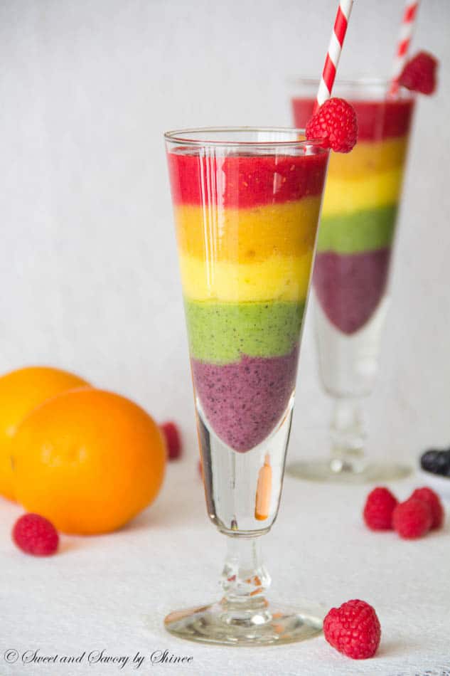 Rainbow Smoothie. Tropical strawberry smoothie, garnished with raseberries. served in a flute glass