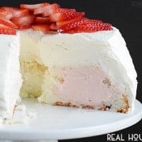 This light and fluffy angel food cake is filled with delicious strawberry cream and frosted with homemade whipped cream. A light and refreshing cake recipe for summer.