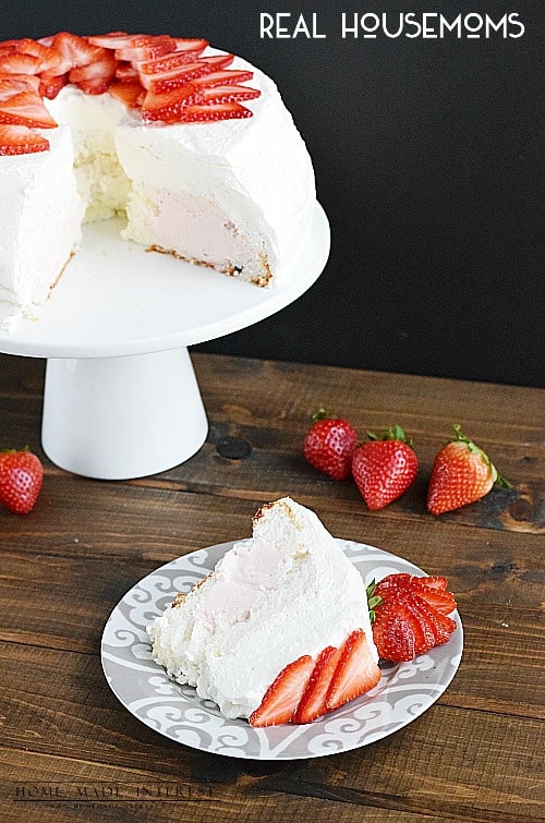 This light and fluffy angel food cake is filled with delicious strawberry cream and frosted with homemade whipped cream. A light and refreshing cake recipe for summer. 