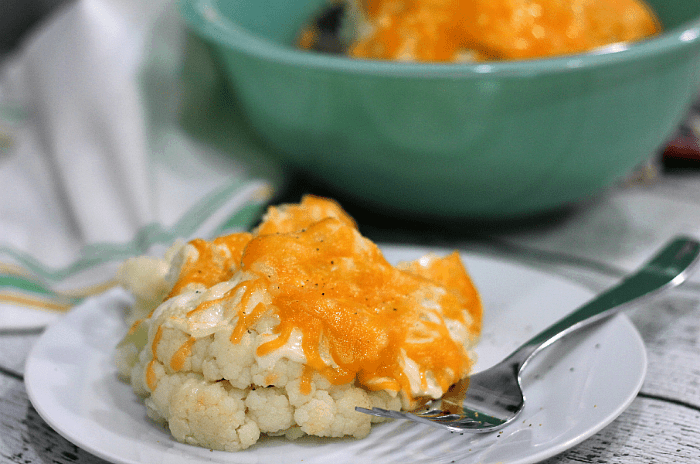 Easy to make and deliciously tangy, this cheesy steamed cauliflower makes a perfect side dish!
