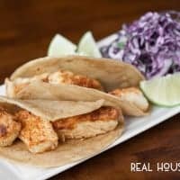 Halibut Fish Tacos served with lime and slaw an option to add to tacos