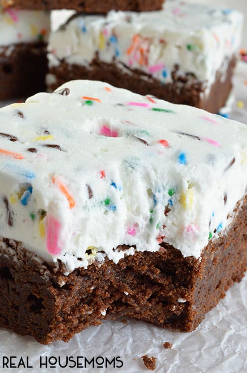 Birthday Brownies are a fun and festive treat! Fudgy brownies topped with fluffy frosting and lots of Sprinkles!