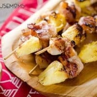 Bacon Wrapped Shrimp and Pineapple Kabobs are served with a creamy Greek yogurt and szechuan sauce for a light and easy dinner recipe perfect for summer grilling season!