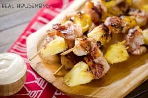 Bacon Wrapped Shrimp and Pineapple Kabobs are served with a creamy Greek yogurt and szechuan sauce for a light and easy dinner recipe perfect for summer grilling season!