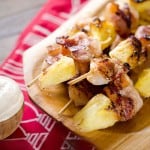 Bacon Wrapped Shrimp and Pineapple Kabobs are served with a creamy Greek yogurt and szechuan sauce for a light and easy dinner recipe perfect for summer grilling season!