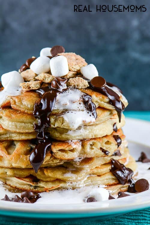 S'Mores Chocolate Chip Pancakes with chocolate ganache and marshmallow syrup are a fun, decadent breakfast that the whole family will love!