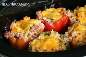 Slow Cooker Sausage and Rice Stuffed Peppers are a new way to stuff peppers! Surprise the family with this delicious dish!