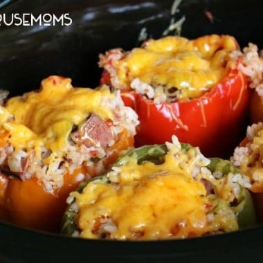 Slow Cooker Sausage and Rice Stuffed Peppers are a new way to stuff peppers! Surprise the family with this delicious dish!