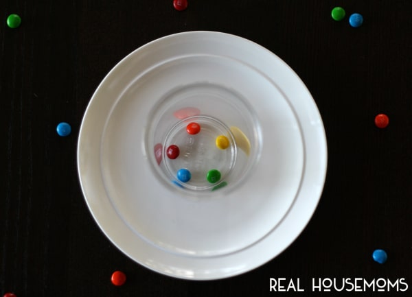 This M and M Rainbow Science Experiment is a simple ot prepare and has major cool factor for the kids!