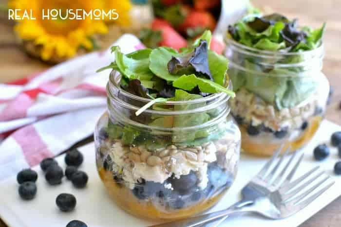 This Summer Harvest Salad in a Jar is loaded with fresh fruit, feta cheese, almonds, sunflower seeds, and a light honey orange vinaigrette. Perfect for summer picnics or a delicious on the go lunch!