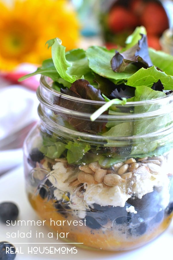This Summer Harvest Salad in a Jar is loaded with fresh fruit, feta cheese, almonds, sunflower seeds, and a light honey orange vinaigrette. Perfect for summer picnics or a delicious on the go lunch!