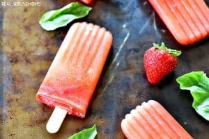 Boozy Strawberry Basil Lemonade Popsicles are crazy awesome out of this world good!!! I love to let them melt in my summer cocktails too!