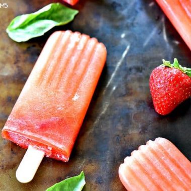 Boozy Strawberry Basil Lemonade Popsicles are crazy awesome out of this world good!!! I love to let them melt in my summer cocktails too!