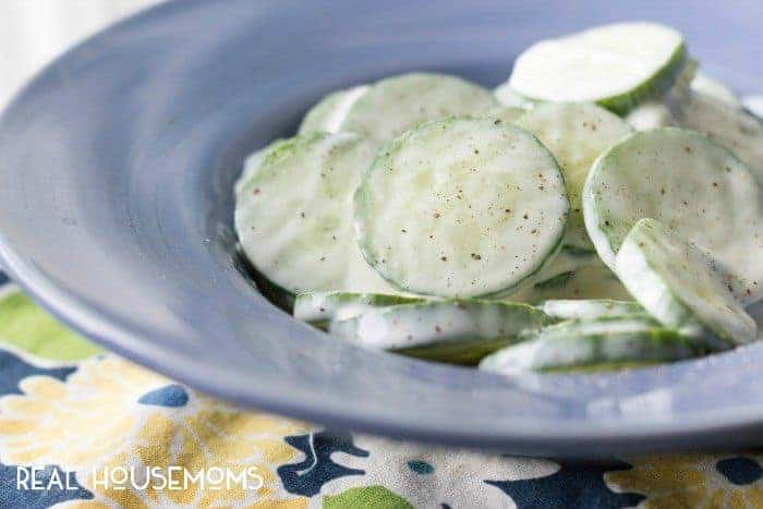 Need a simple, healthy and delicious side dish? These creamy cucumbers will be everyone's favorite at your next BBQ!