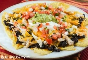 Easy Chipotle Chicken Nachos are a seriously delicious appetizer with spicy chicken that's ready to eat in 10 minutes!