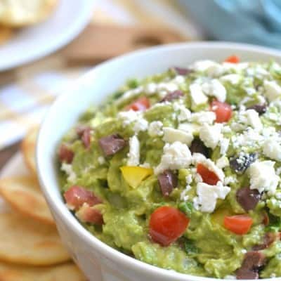 Mediterranean Guacamole combines some of my favorite flavors into one delicious dip! It's a fun twist on the original, and perfect for summer entertaining!!