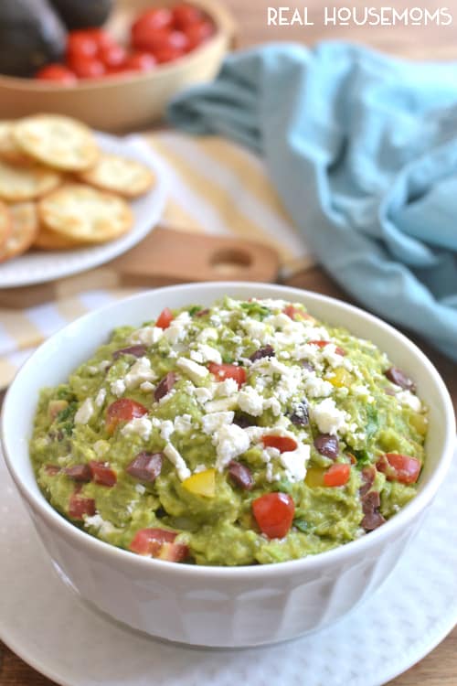Mediterranean Guacamole combines some of my favorite flavors into one delicious dip! It's a fun twist on the original, and perfect for summer entertaining!!