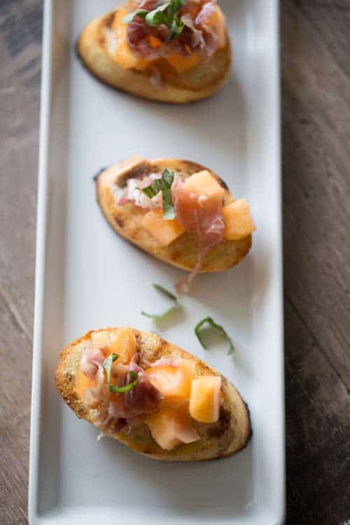 This sweet and savory Proscuitto Melon Bruschetta will impress over and over again!