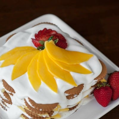This easy to make no bake Mango Coconut Ginger Icebox Cake made with ginger cookies, fresh mango, and coconut cream is the perfect summer time dessert!