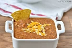 3 Ingredient Crock Pot Bean Dip is my go to football appetizer! It's crazy popular with my crowd!