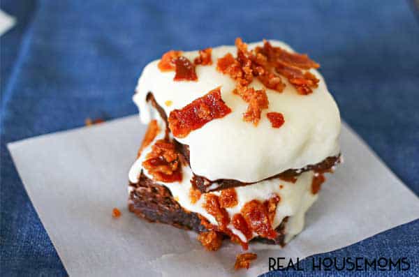 This rich & fudgy homemade brownie recipe is topped with a simple 3 ingredient frosting & salty bits of bacon. Delicious salty & sweet bacon brownies!