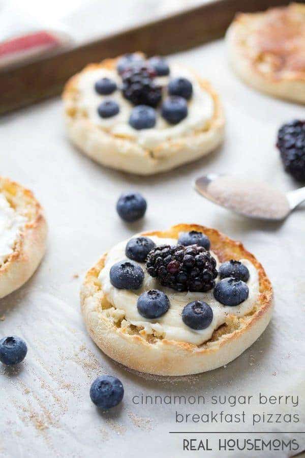 Mix up your breakfast routine with these fun and delicious Cinnamon Sugar Berry Breakfast Pizzas! They're made on an English muffin, making these super easy to whip up first thing in the morning!