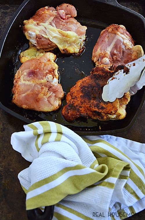 Chili Rubbed Chicken with Apricot Glaze combines spicy rubbed chicken thighs with a fruity, sweet glaze to create a deliciously balanced barbecued chicken you'll want to eat again and again!