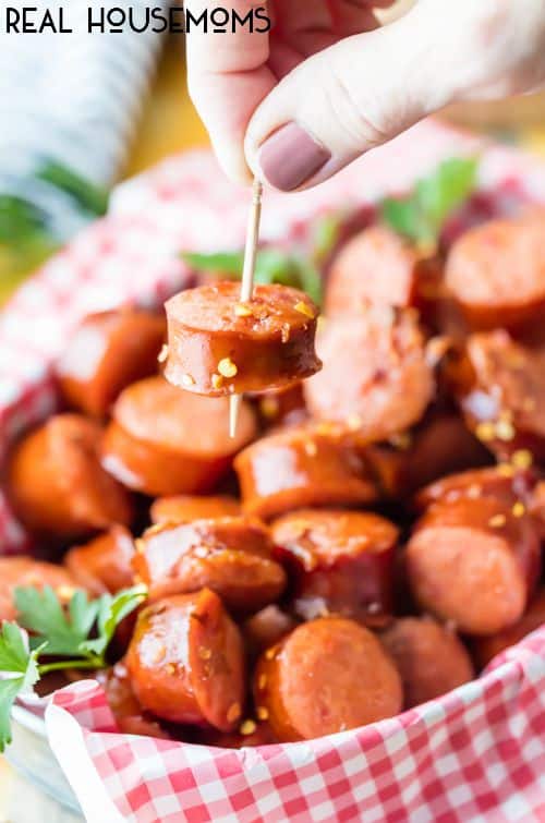 Sweet and Spicy Slow Cooker Kielbasa Bites are the perfect crowd pleasing snack for your next tailgate!