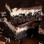 Decadent fudgy Almond Joy Brownies have a layer of sweet coconut filling and crunchy almonds, all topped with a layer of chocolate ganache. The perfect brownie for any Almond Joy lover!