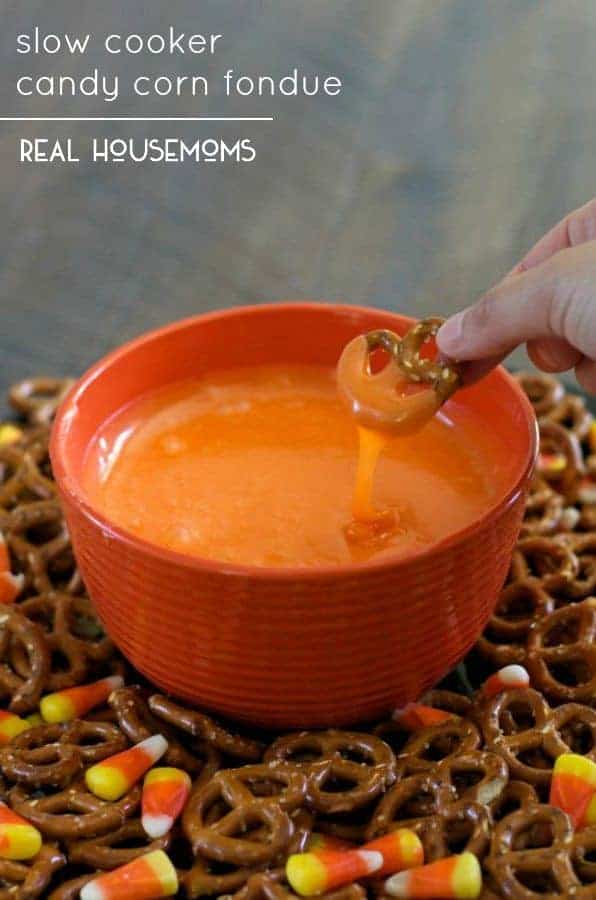 Serve this sweet Slow Cooker Candy Corn Fondue with salty pretzels for a fun Halloween treat!