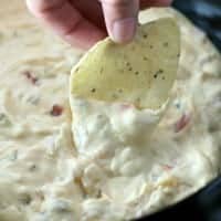 This fantastic Slow Cooker Queso Dip is an easy crowd pleaser that's nice and warm for when the days start to get cooler!
