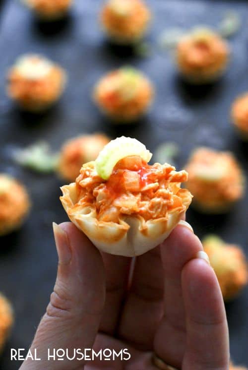 Buffalo Chicken Salad Bites are the perfect bite-sized appetizer featuring spicy buffalo chicken salad served in crisp phyllo shells!