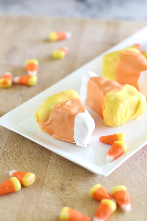 Candy corn cake bites would make a delicious and super cute bite size treat for your halloween party
