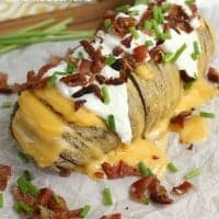 These Fully Loaded Hasselback Potatoes are packed full of bacon, cheese, sour cream, chives, everything you love on a baked potato!