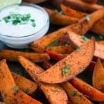 Skip the greasy fries and enjoy these scrumptious baked Sweet Potato Wedges with Honey Lime Dip!