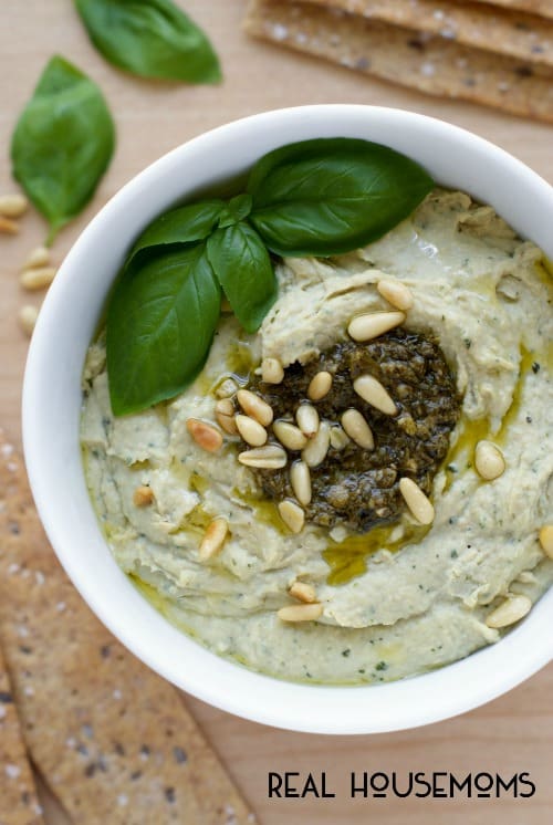BASIL PESTO HUMMUS is an easy to make dip that has classic pesto ingredients blended in, making it a fresh and flavorful appetizer!