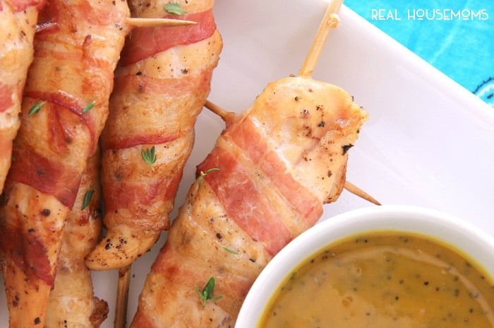 Everything is better with bacon, especially these BACON-WRAPPED CHICKEN SKEWERS WITH HONEY MUSTARD DIPPING SAUCE!