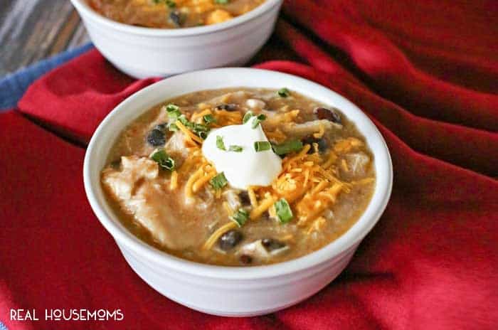 Shredded chicken, black beans, salsa verde & more come together in this simple & easy crockpot BLACK BEAN & CHICKEN SOUP. Perfect for chilly winter days!