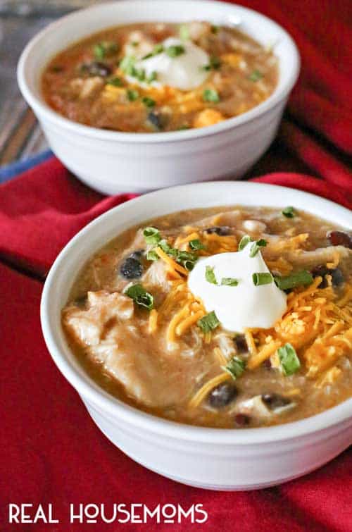 Shredded chicken, black beans, salsa verde & more come together in this simple & easy crockpot BLACK BEAN & CHICKEN SOUP. Perfect for chilly winter days!