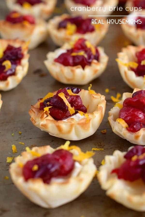These CRANBERRY BRIE CUPS are just about as easy an appetizer as you can get, and they are so beautiful and delicious!