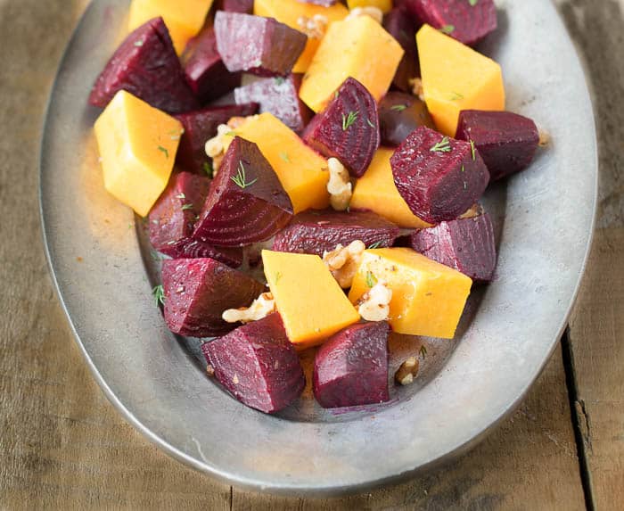 ROASTED HONEY GINGER BEETS AND WINTER SQUASH are simple roasted vegetables with a to die for dressing! Everything in this dish is good for you and there's no skimping on flavor!