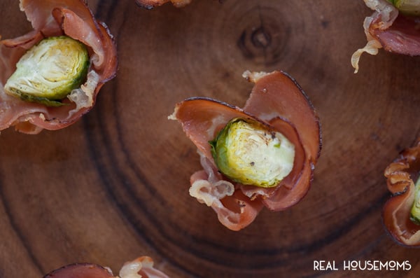 If you're looking for an easy yet unique appetizer that's perfect for any party, look no further than these tasty BRUSSEL SPROUT PROSCIUTTO CUPS!