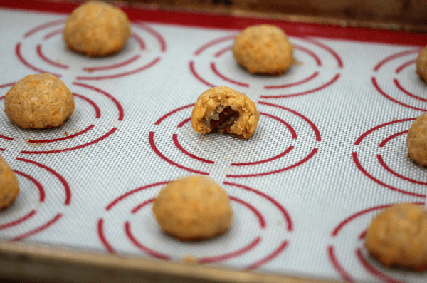 These CHEDDAR OLIVE BITES are packed with tangy, cheesy flavor- your guests will devour them!