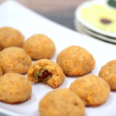 These CHEDDAR OLIVE BITES are packed with tangy, cheesy flavor- your guests will devour them!